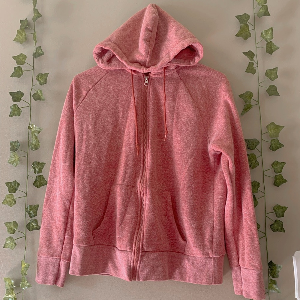 This is a  light, redish jacket with a sliver zipper.